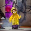Fun Express Standing Doll in Raincoat Halloween Decoration