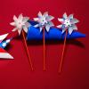 Fun Express Patriotic UV Light Color-Changing Pinwheels – 6.5″ x 14.75″ (Pack of 12) – Perfect for 4th of July Celebrations, Parades, and Outdoor Festivities