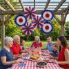 Fun Express 16″ diam. Patriotic Red, White & Blue Hanging Paper Fans – 6 Pieces